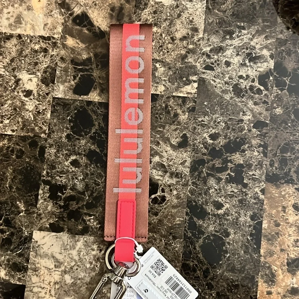 LULULEMON NEVER LOST KEYCHAIN ORANGE AND BROWN COLOR NWT